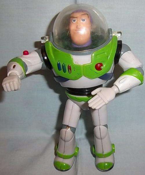 A VINTAGE BUZZ LIGHTYEAR WITH POINTING LAZER BY THINKWAY