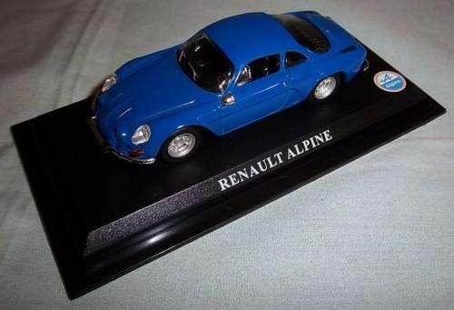 A BLUE RENAULT ALPINE DIE CAST CAR ON A STAND