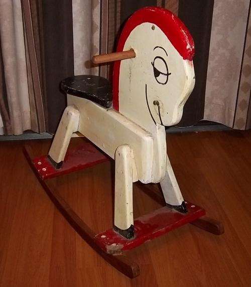 A CUTE SMALL VINTAGE WOODEN ROCKING HORSE