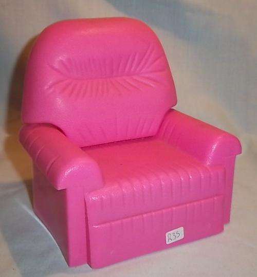 A PINK BARBIE SIZED COUCH