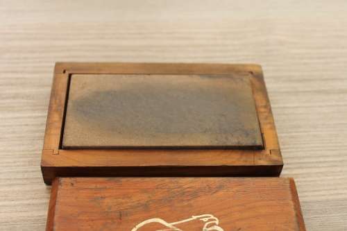 Vintage honing stone in a wooden box