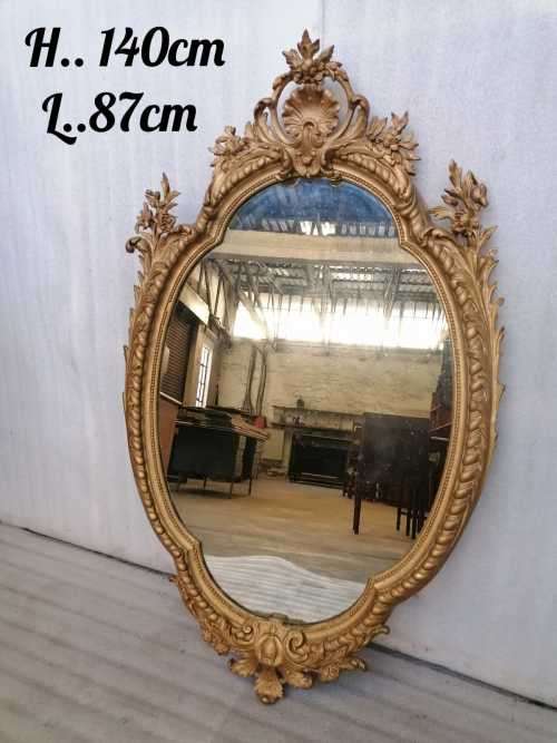 19 TH Century Louis XV style mirror in  stuccoed and gilded wood