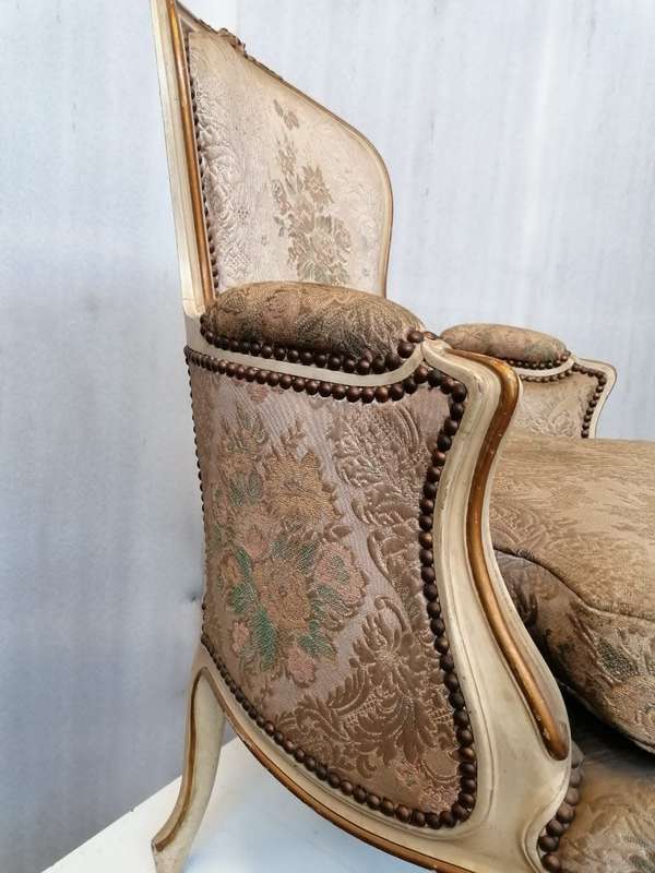 A  French Pair of Painted Louis XV style and Gold leafed Bergere Chairs