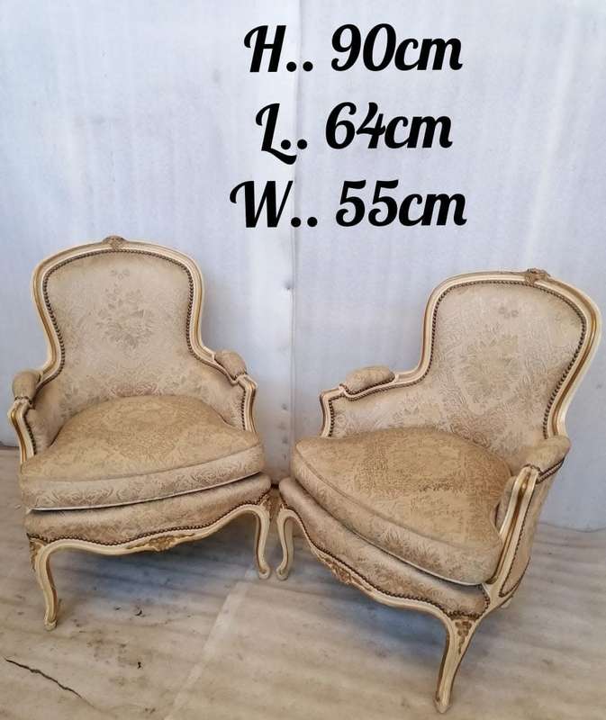 A  French Pair of Painted Louis XV style and Gold leafed Bergere Chairs