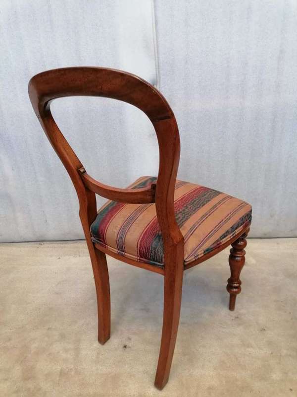 A set of 6 Mahogany Balloon back chairs