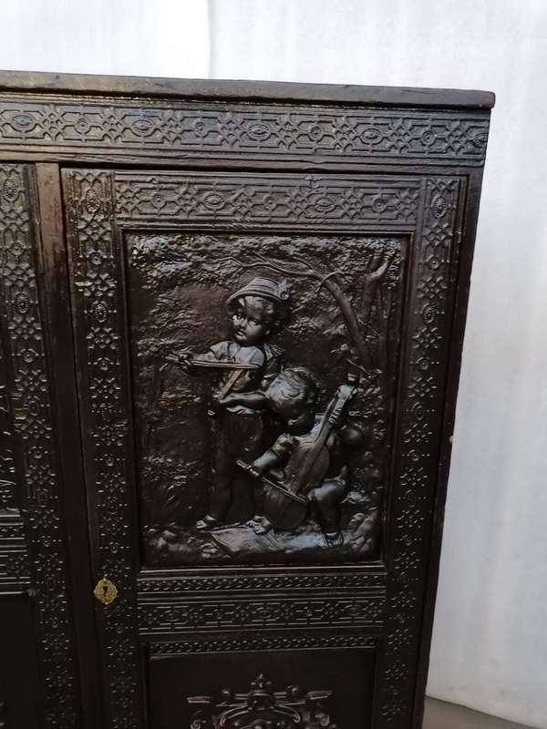 A 19th century German cabiet with beautiful Repoussè leather doors