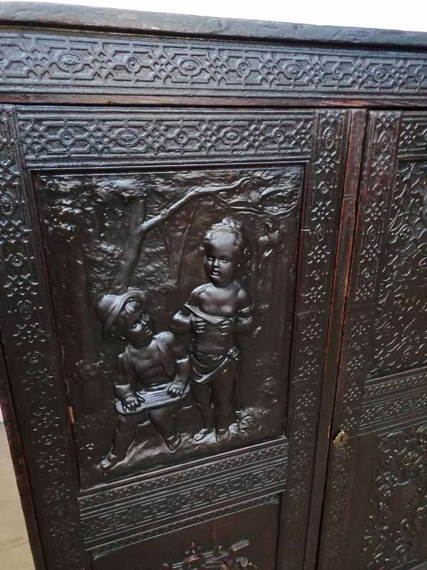 A 19th century German cabiet with beautiful Repoussè leather doors