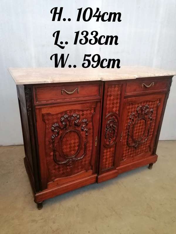 A pair of Louis XVI style cabinets with parquetry inlay and Marble tops.