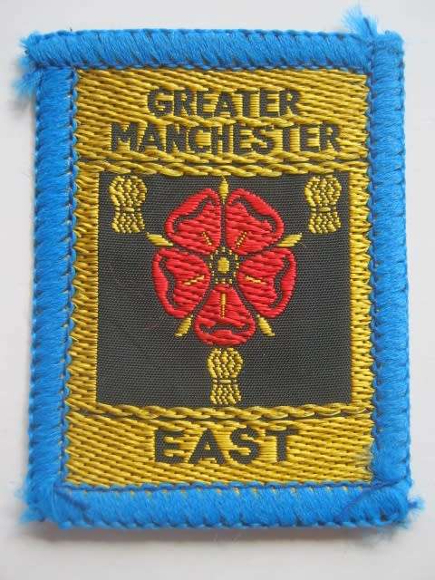 BRITISH BOY SCOUT BADGE - GREATER MANCHESTER EAST DISTRICT BADGE (CLOTH) - MINT CONDITION