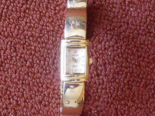 HIGH CLASS JUSTIN GOLD COATED WATCH  IN A BEAUTIFUL SETTING
