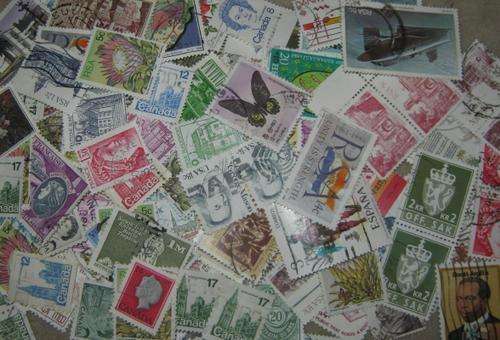 450  World Mix Stamps  (UNSORTED) bid per stamp to take all