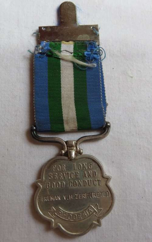 FULL SIZE RHODESIA FIRE BRIGADE MEDAL NAMED TO:FIREMAN V.H. ZERF(RETD)