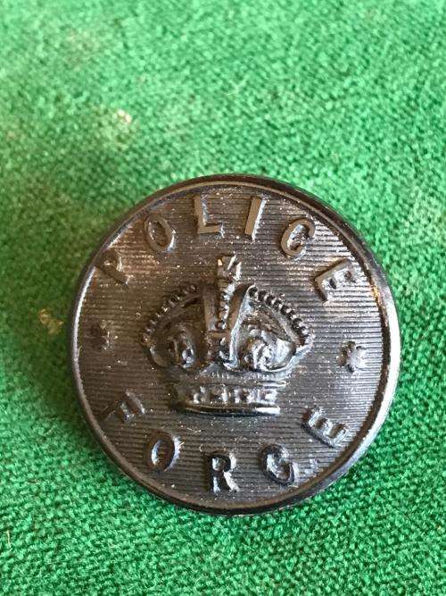 POLICE BLACK COMPOSITION BUTTON 25MM IN DIAMETER-WORN ON GREAT COAT BY FOOT POLICE