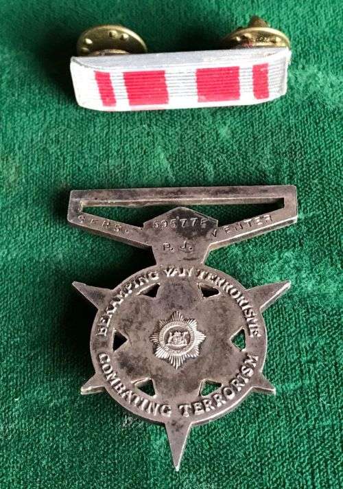 FULL SIZE POLICE MEDAL FOR COMBATING TERRORISM-AWARDED TO SERS. P.J. VENTER 59577E- NO RIBBON