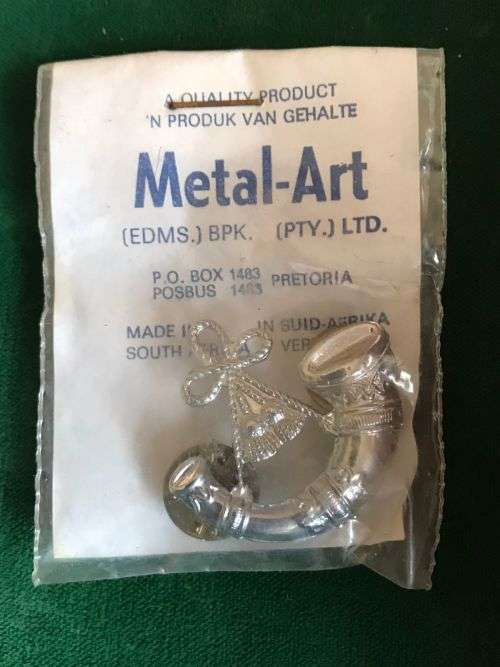SA CHROMED  BUGLER BADGE IN ORIGINAL PACKAGING - 2 PINS