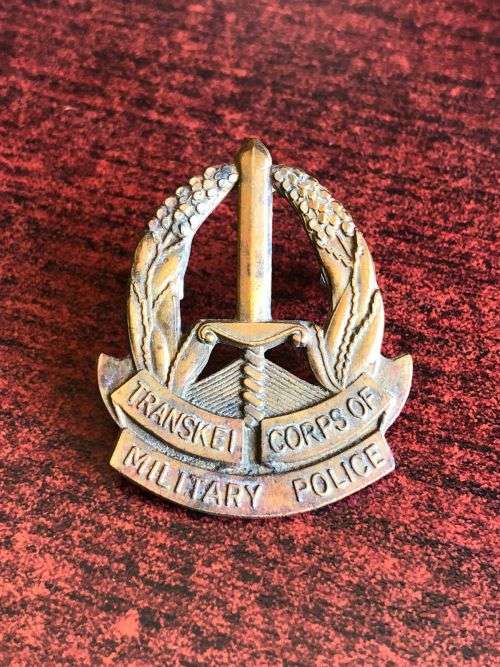 TRANSKEI CORPS OF MILITARY POLICE BRASS CAP BADGE- 2X SCREW LUGS