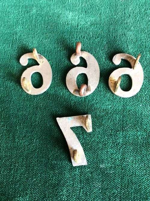 EARLY WHITE METAL NUMERALS-MEASURES 20 MM-2 LUGS - 4 SOLD TOGETHER-WORN ABOVE SHOULDER TITLE AND ON