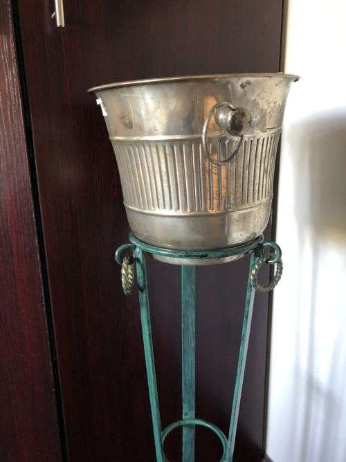 ICE BUCKET ON PAINTED WRAUGHT IRON STAND-THE BUCKET IS PLATED SILVER WITH A DIAMETER OF 24 CM AT THE