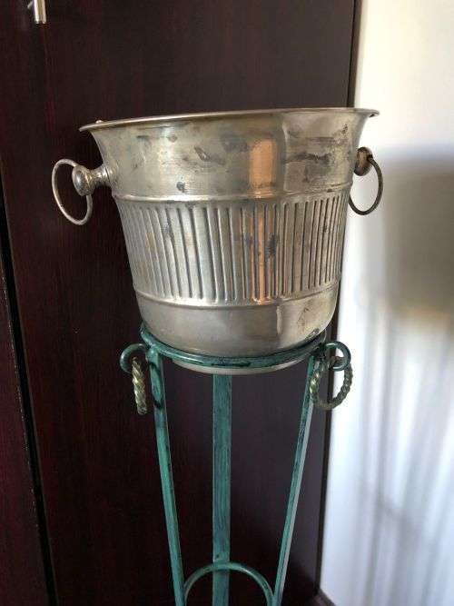 ICE BUCKET ON PAINTED WRAUGHT IRON STAND-THE BUCKET IS PLATED SILVER WITH A DIAMETER OF 24 CM AT THE