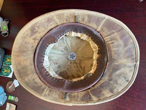 SA MADE WW2 PITH HELMET STAMPED AND DATED-THE PAPER INSIDE THE LEATHER LINER IS JUST TO PROTECT THE