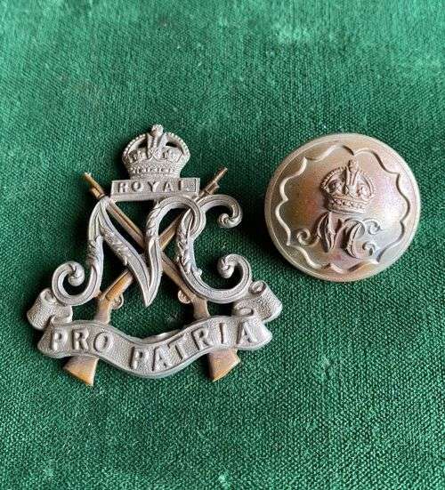 ROYAL NATAL CARBINEERS CAP BADGE,WHITE METAL-WORN 1936-1940-SOLD WITH ONE BUTTON-DIAMETER 150MM-CAP
