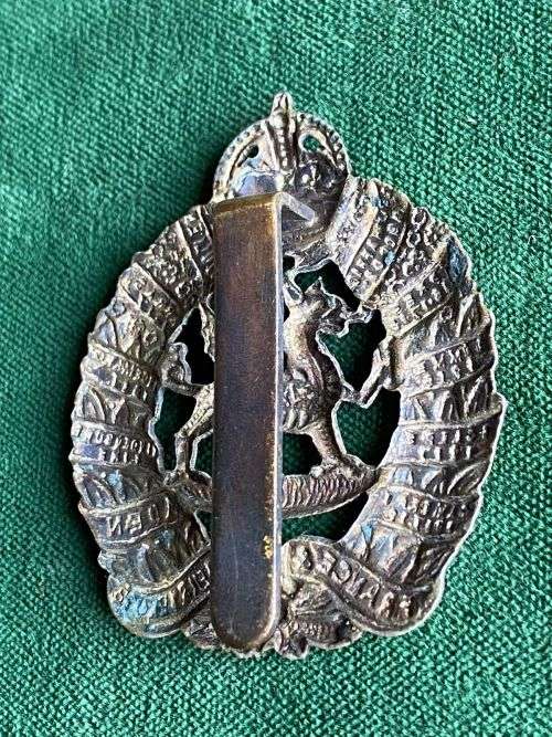 WHITE METAL 1ST BATTALION MONMOUTHSHIRE REGIMENT CAP BADGE