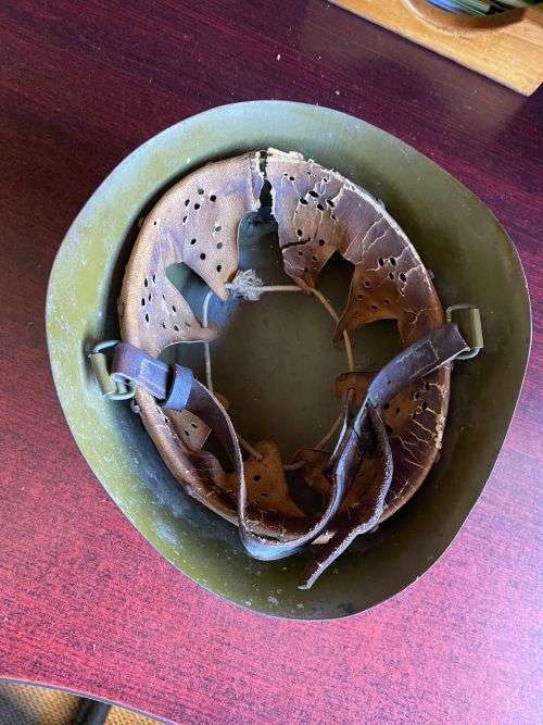 BULGARIAN M72 STEEL HELMET-USED IN ANGOLA DURING THE BORDER WAR-THERE IS A PLATE STUCK TO THE FRONT