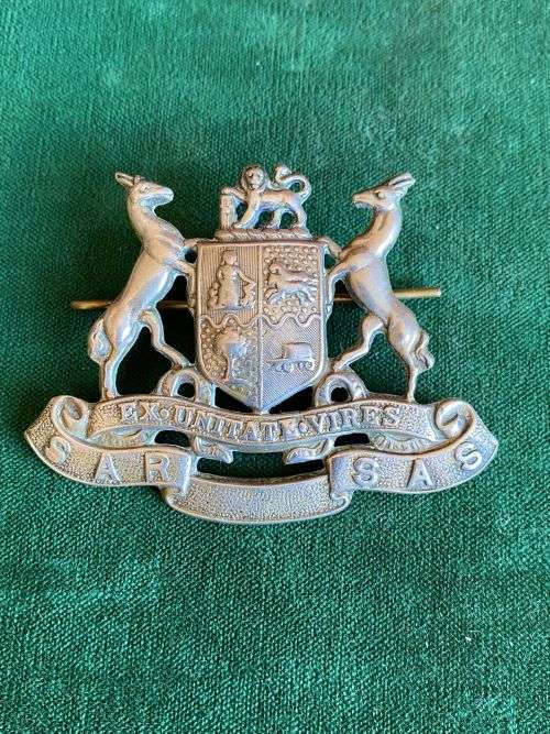 SOUTH AFRICAN RAILWAYS,WHITE METAL CAP BADGE- 2 LUGS