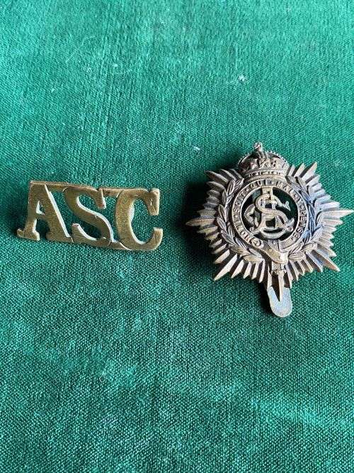 ROYAL ARMY SERVICE CORPS CAP BADGE AND TITLE- 1902-18-LUGS + SLIDER INTACT