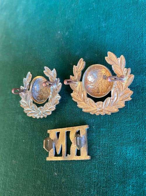 ROYAL MARINES COLLAR BADGE PAIR AND ONE TITLE-WORN FROM 1923-LUGS INTACT