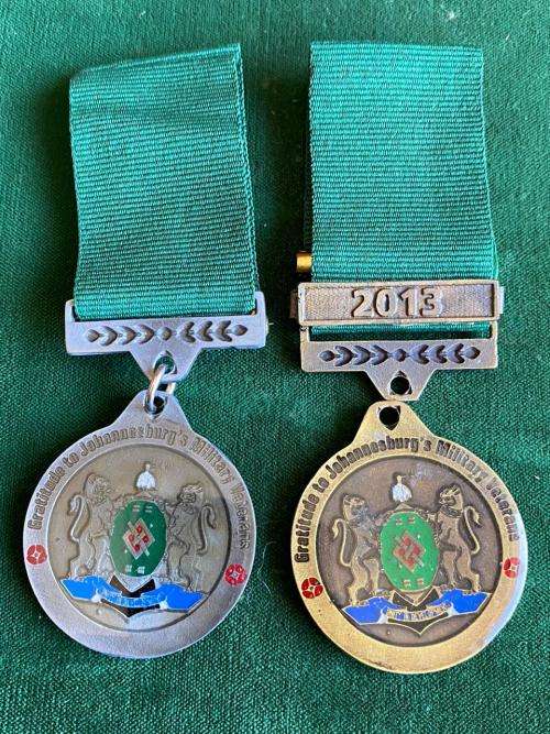 2X MEDALS FOR GRATITUDE TO JOHANNESBURG`S MILITARY VETERANS-BOTH ARE NUMBERED