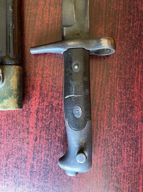 ITALIAN 1870/15 WITH THE RIGHT HILT SHOWING THE ORIGINAL LONG LEAF SPRING-BRASS MOUNTED LEATHER SCAB