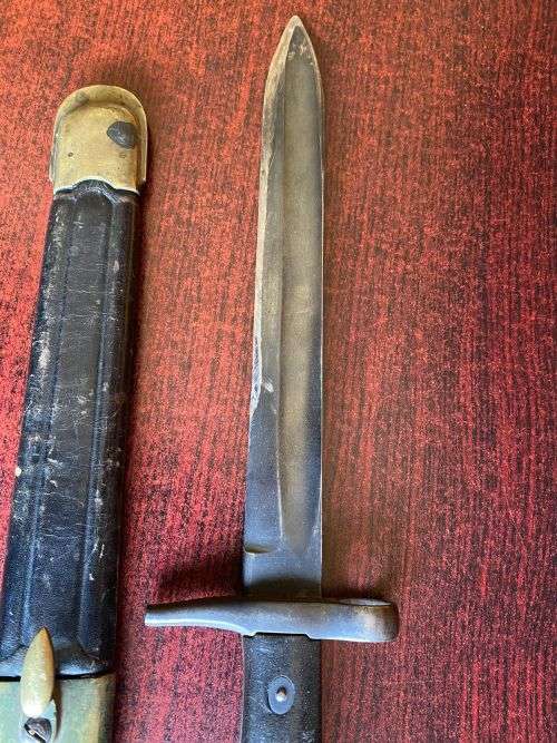 ITALIAN 1870/15 WITH THE RIGHT HILT SHOWING THE ORIGINAL LONG LEAF SPRING-BRASS MOUNTED LEATHER SCAB