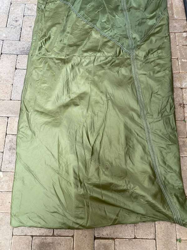 MILITARY ISSUE SLEEPING BAG-LOOKS LIKE PARACHUTE MATERIAL,WITH VELCRO ON THE ONE SIDE-COMES WITH CO