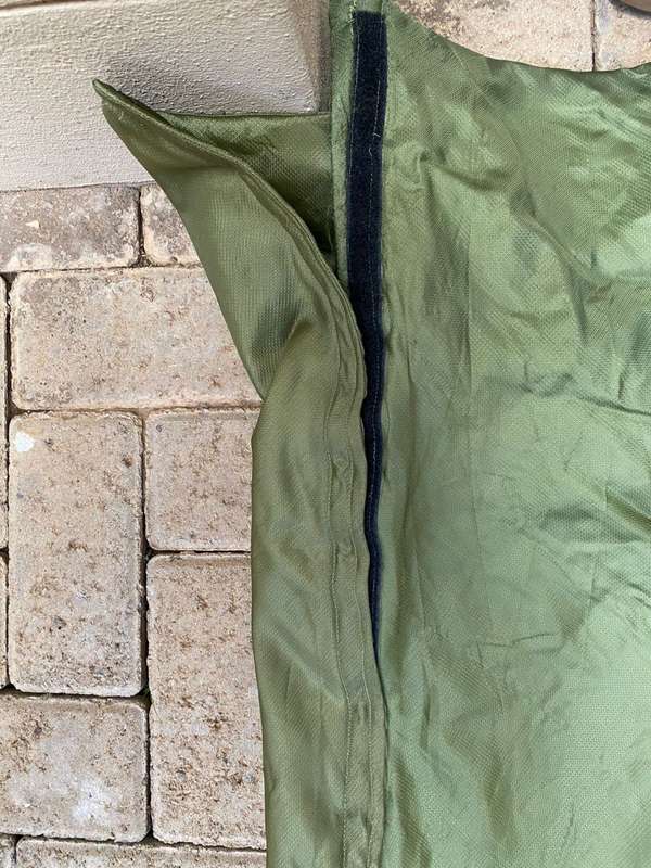 MILITARY ISSUE SLEEPING BAG-LOOKS LIKE PARACHUTE MATERIAL,WITH VELCRO ON THE ONE SIDE-COMES WITH CO