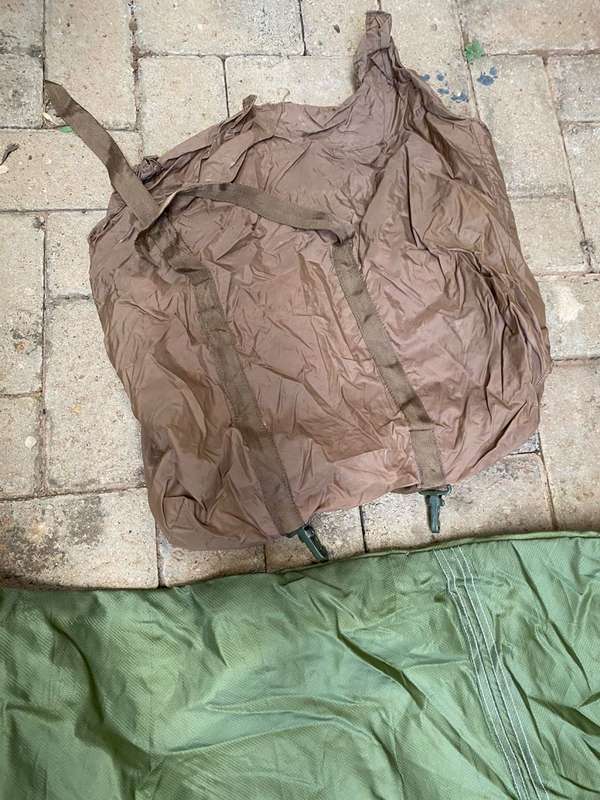 MILITARY ISSUE SLEEPING BAG-LOOKS LIKE PARACHUTE MATERIAL,WITH VELCRO ON THE ONE SIDE-COMES WITH CO