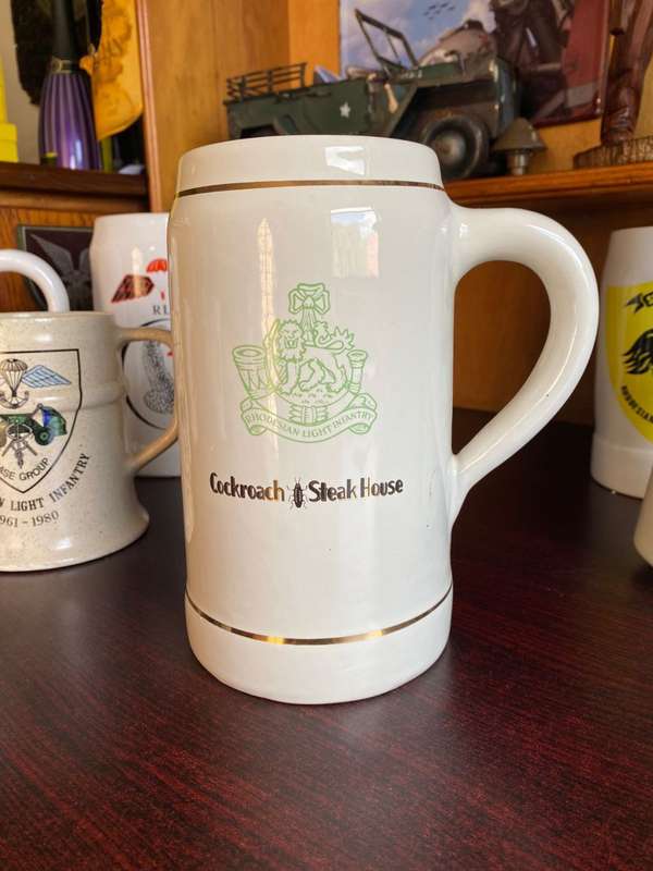 LARGE RHODESIAN LIGHT INFANTRY MUG-COCKROACH STEAK HOUSE-NORBEL POTTERIES RHODESIA,MAKERS STAMP-HEIG