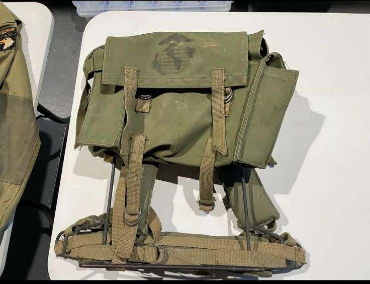 RHODESIAN MILITARY ISSUE BACKPACK WITH METAL FRAME AND SLEEPING BAG COVER-LOOKING AT THE LOGO ON THE