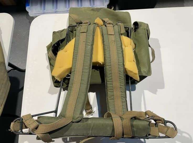 RHODESIAN MILITARY ISSUE BACKPACK WITH METAL FRAME AND SLEEPING BAG COVER-LOOKING AT THE LOGO ON THE