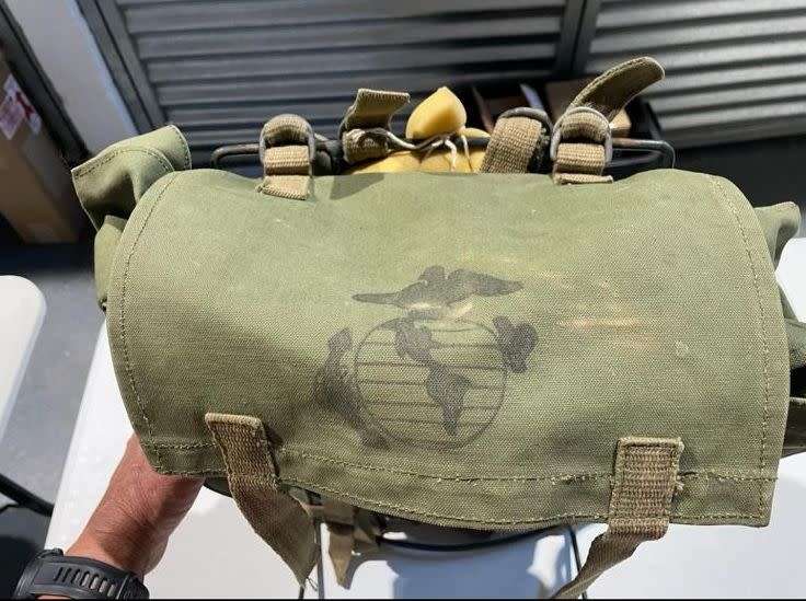 RHODESIAN MILITARY ISSUE BACKPACK WITH METAL FRAME AND SLEEPING BAG COVER-LOOKING AT THE LOGO ON THE