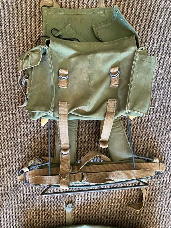 RHODESIAN MILITARY ISSUE BACKPACK WITH METAL FRAME AND SLEEPING BAG COVER-LOOKING AT THE LOGO ON THE