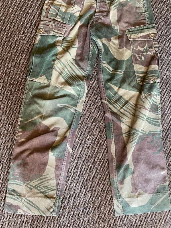 ORIGINAL BATTLE USED,RHODESIAN CAMO TROUSERS SIZE 28-INSIDE LEG MEASURES 71 CM-ALL BUTTONS INTACT-US