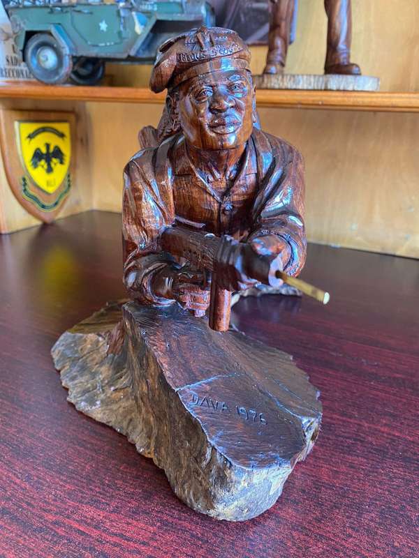 EXTREMELY WELL CARVED,WITH A LOT OF DETAIL OF A RHODESIAN SELOUS SCOUT SOLDIER-SIGNED AND DATED 1976