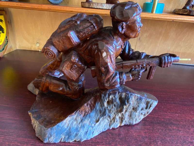 EXTREMELY WELL CARVED,WITH A LOT OF DETAIL OF A RHODESIAN SELOUS SCOUT SOLDIER-SIGNED AND DATED 1976
