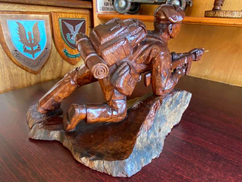 EXTREMELY WELL CARVED,WITH A LOT OF DETAIL OF A RHODESIAN SELOUS SCOUT SOLDIER-SIGNED AND DATED 1976