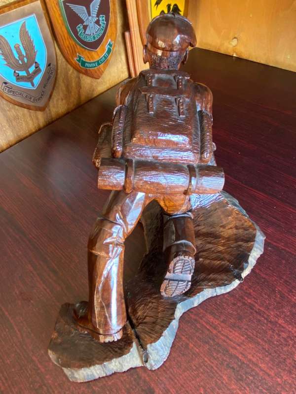 EXTREMELY WELL CARVED,WITH A LOT OF DETAIL OF A RHODESIAN SELOUS SCOUT SOLDIER-SIGNED AND DATED 1976