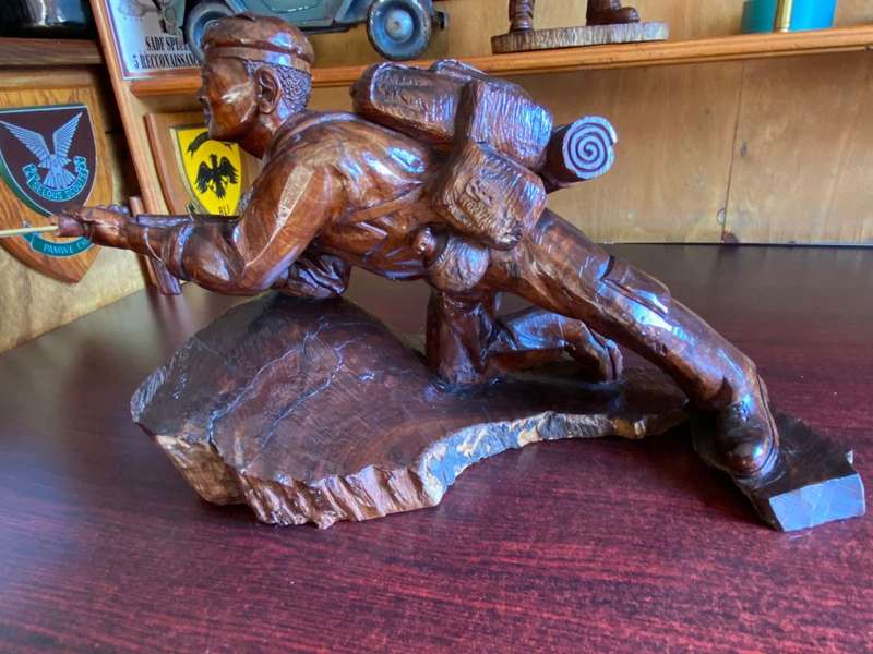 EXTREMELY WELL CARVED,WITH A LOT OF DETAIL OF A RHODESIAN SELOUS SCOUT SOLDIER-SIGNED AND DATED 1976