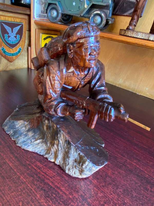 EXTREMELY WELL CARVED,WITH A LOT OF DETAIL OF A RHODESIAN SELOUS SCOUT SOLDIER-SIGNED AND DATED 1976