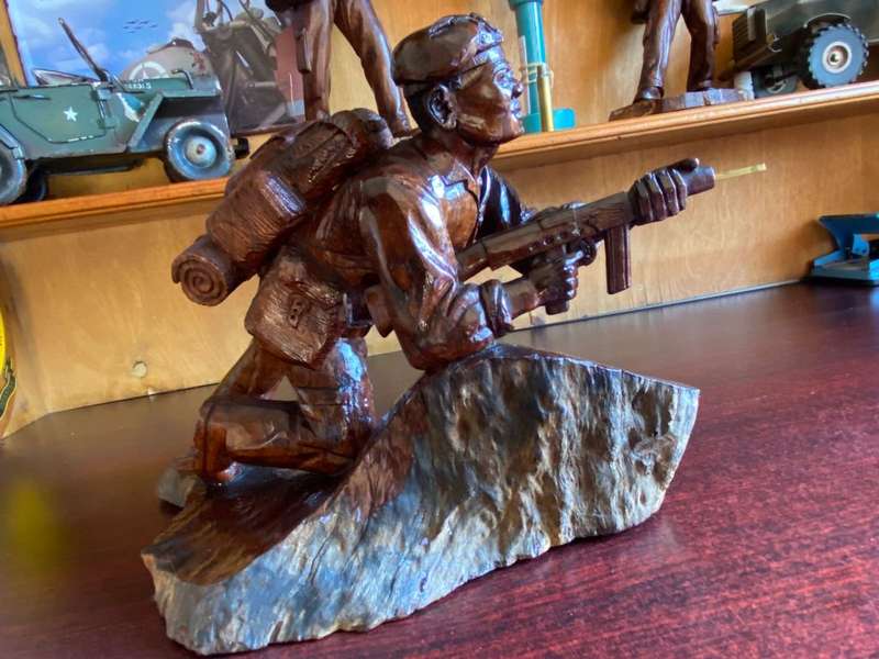 EXTREMELY WELL CARVED,WITH A LOT OF DETAIL OF A RHODESIAN SELOUS SCOUT SOLDIER-SIGNED AND DATED 1976