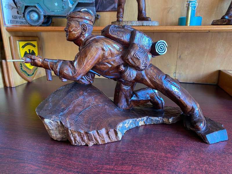 EXTREMELY WELL CARVED,WITH A LOT OF DETAIL OF A RHODESIAN SELOUS SCOUT SOLDIER-SIGNED AND DATED 1976